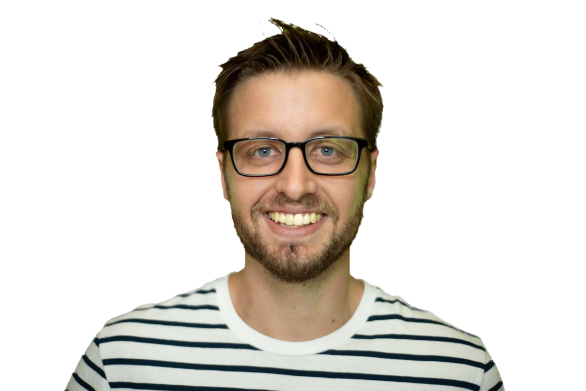 Jim Schindler, smiling, in glasses and a striped tee